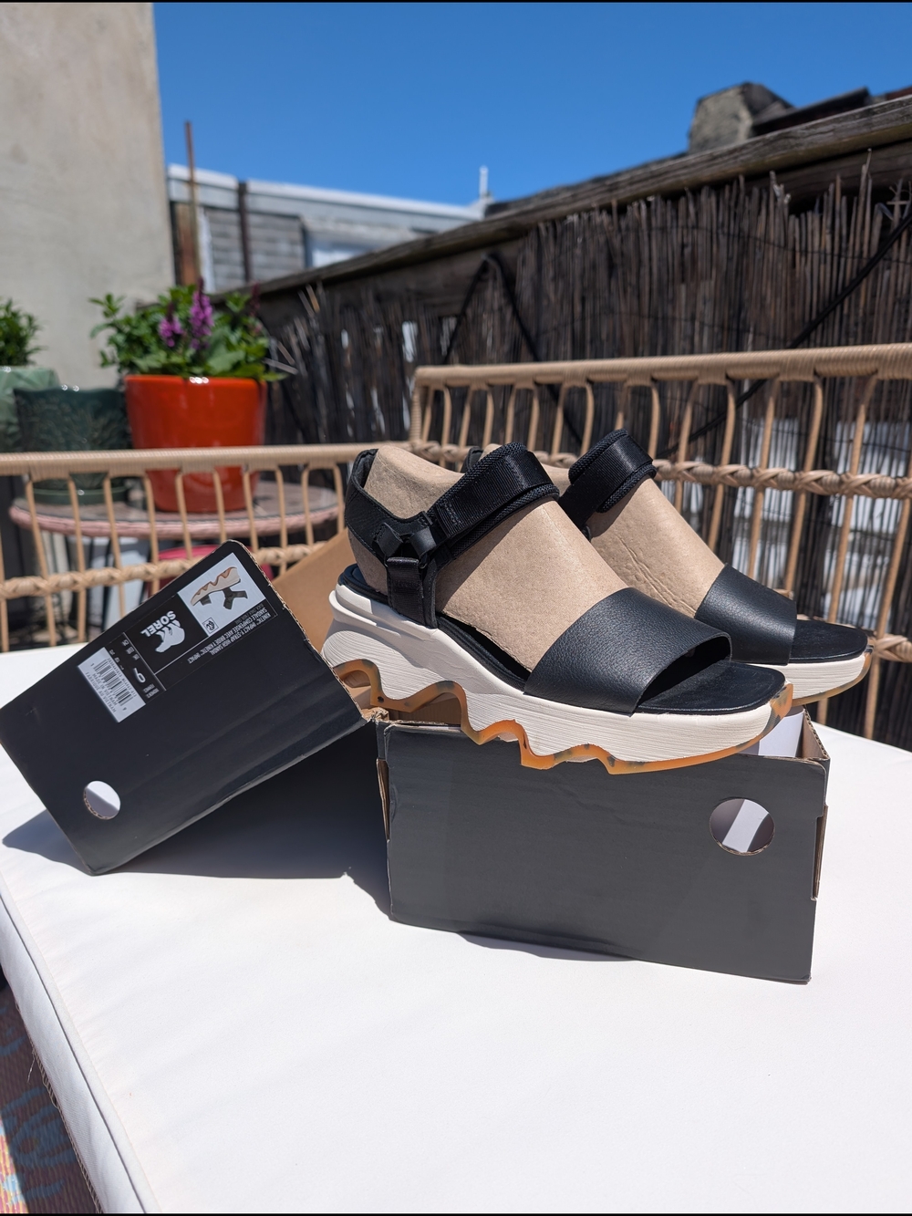 Sorel Kinetic Impact Sandals in Black and Beige